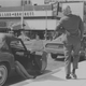 Original caption from 1966: “Joe Beagin, founder of the International Society of Girl Watchers uses the ploy of stretching his shoulder in order to leer unnoticed at a seated woman.”